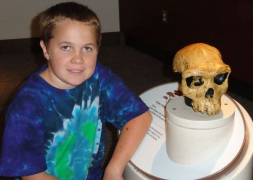 My son Manuha with a Homo heidelbergensis skull at Smithsonian