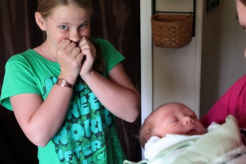 baby with cute child watching